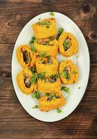 Pumpkin rolls, pie with mushrooms photo