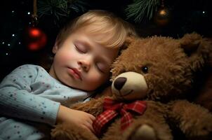 Toddler boy in pajamas sleeps with a teddy bear near the Christmas tree. Generative AI photo