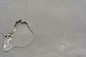 concrete crack wall background. cracked weathered concrete background photo