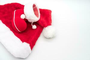 Santa's boot on Santa Claus red hat isolated on white background. Christmas background. photo