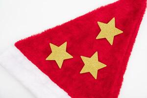 Santa Claus red hat and Gold Star isolated on white background. Christmas background. photo