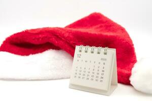 December's calendar image with Santa Claus red hat isolated on white background. Christmas background. photo