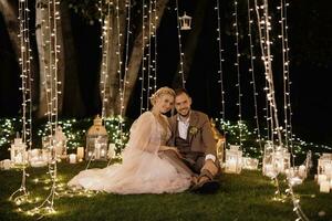 night wedding ceremony of the newlyweds in a country cottage photo