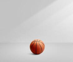 A basketball in a white room with light photo