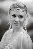 portrait of a happy bride in a light light dress in  wearing elven accessories photo