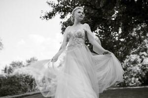 portrait of a happy bride in a light light dress in  wearing elven accessories photo