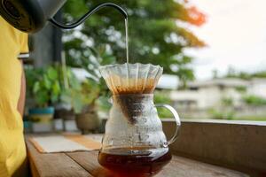 Drip coffee is a method of brewing pour-over or filter brewers in which the method of brewing coffee without a brewer is simply using water through coffee grounds and paper filter photo