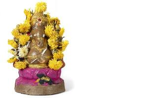 Hindu festival Ganesh Chaturthi Beautiful clay Ganesh statue with garland on white background. photo