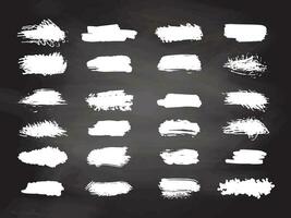 Grunge white brush strokes, paint roller elements on chalkboard background. Set of hand drawn vector  ink splash elements.