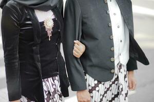 a man and a woman dressed in traditional clothing photo