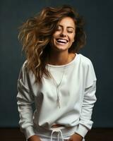 Young woman smiling wearing sweatshirt isolated photo