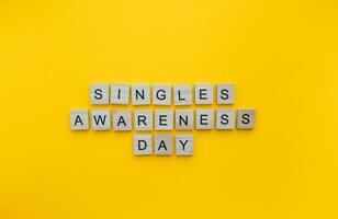 February 14, Singles Awareness Day, Singles Appreciation Day, minimalistic banner with the inscription in wooden letters photo