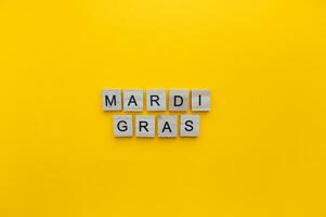 February 21, Mardi Gras, Fat Tuesday, minimalistic banner with the inscription in wooden letters photo