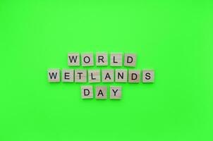 February 2, World Wetlands Day, minimalistic banner with the inscription in wooden letters photo