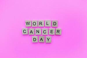 February 4, World Cancer Day, minimalistic banner with the inscription in wooden letters photo