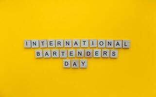 February 6, International Bartenders Day, minimalistic banner with the inscription in wooden letters photo