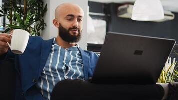 Business professional review analytics, looking at past online reports on laptop. Focused company worker solving strategy problems to prepare startup management for development. photo