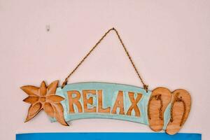 relax sign on the wall photo