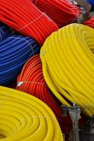 a pile of colorful hoses photo