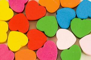 a pile of colorful wooden hearts photo