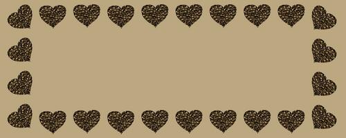 A pattern in form of frame of Hearts isolated on beige background. Coffee beans are poured in the shape of hearts. Photo with copy space.