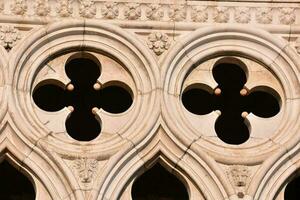 the windows of a building have four crosses on them photo