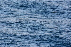 the ocean is seen from above with waves photo