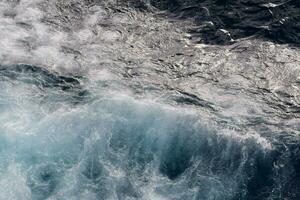 the ocean is seen from above with waves photo