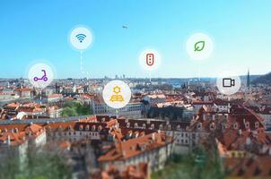 Smart city concept with icons floating above the city. The concept of clean air control, transportation, security, solar energy, connectivity photo