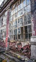 Old building with damaged windows concept photo. European towers. photo