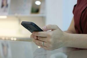 Hand using smartphone, technology concept photo