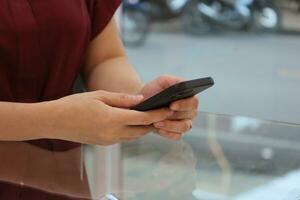 Hand using smartphone, technology concept photo