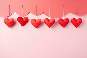 San Valentín día antecedentes con rojo papel corazones en rosado fondo, rojo papel cortar corazones colgando en rosado fondo, ai generado foto
