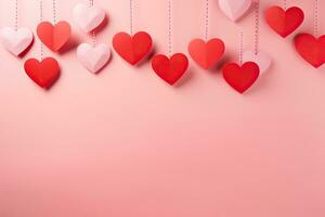 San Valentín día antecedentes con papel corazones en un rosado fondo, rojo papel cortar corazones colgando en rosado fondo, ai generado foto