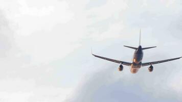 Jet passenger aircraft fly away, rear view. Background. Airplane takes off, climbing. Cinematic shot plane at sunset video