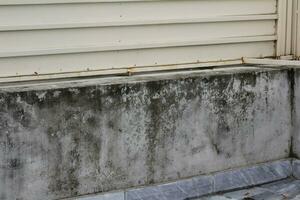 Damage caused by damp on a wall in modern house photo