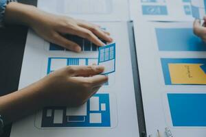 ux Graphic designer creative sketch planning application process development prototype wireframe for web mobile phone . User experience concept. photo