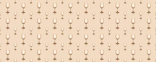 Seamless pattern of empty wine glasses on beige background. photo
