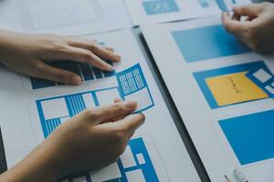 ux Graphic designer creative sketch planning application process development prototype wireframe for web mobile phone . User experience concept. photo