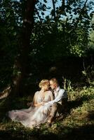 wedding walk of the bride and groom in a coniferous in elven accessories photo