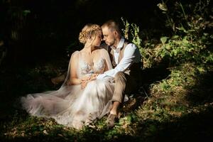 wedding walk of the bride and groom in a coniferous in elven accessories photo