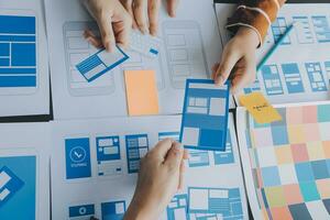 ux Graphic designer creative sketch planning application process development prototype wireframe for web mobile phone . User experience concept. photo