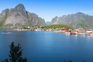 Picturesque fishing town of Reine by the fjord on Lofoten islands in Norway photo