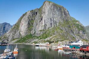 Picturesque fishing town of Reine by the fjord on Lofoten islands in Norway photo