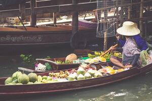 Traditional floating market in Damnoen Saduak near Bangkok photo