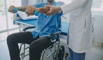 Physical therapist guiding patient with resistance band photo