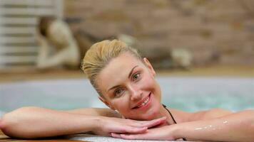 Girl smiling happy at camera during relaxing video