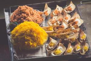 Thai food. Spicy food at Damnoen Saduak Floating Market near Bangkok, Thailand photo