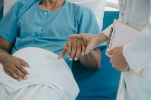 Doctors do it for the health of it. Shot of a mature doctor examining his patient who is concerned about his knee. photo