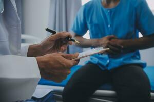 Doctor and patient discussing perfect health exam results. Friendly physician is explaining something to young woman. Medicine concept photo